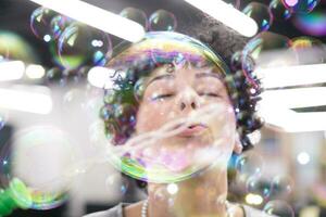 software developer having fun while making soap bubble photo