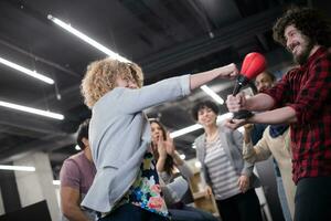 multiethnics business team boxing at office photo