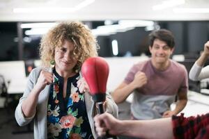 multiethnics business team boxing at office photo