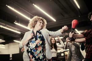 multiethnics business team boxing at office photo