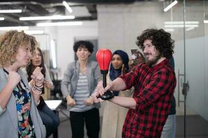 multiethnics business team boxing at office photo