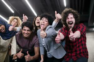 portrait of young excited multiethnics business team photo