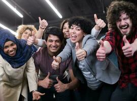 portrait of young excited multiethnics business team photo