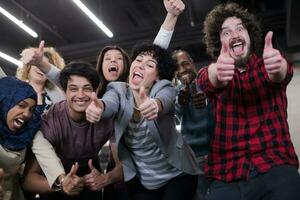 portrait of young excited multiethnics business team photo