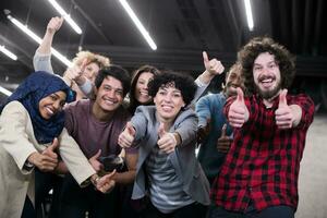 portrait of young excited multiethnics business team photo