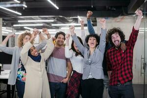 portrait of young excited multiethnics business team photo