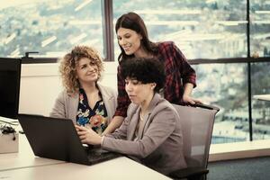 female software developers using laptop computer photo