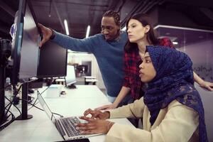 multiethnics team of software developers working together photo