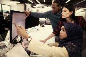 multiethnics team of software developers working together photo