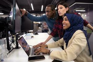 multiethnics team of software developers working together photo