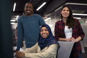 multiethnics team of software developers working together photo