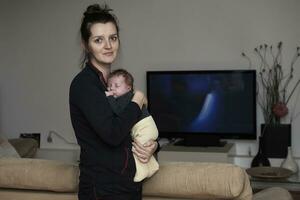 mother is playing with baby at home photo