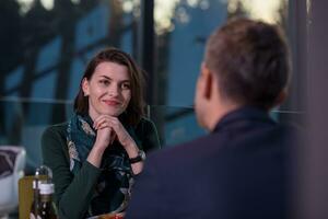 loving couple enjoying romantic dinner photo