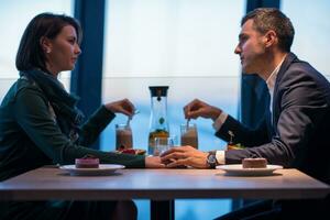 loving couple enjoying romantic dinner photo