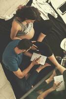 top view of couple checking a list of things for their unborn baby photo