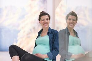 pregnant women sitting on the floor photo