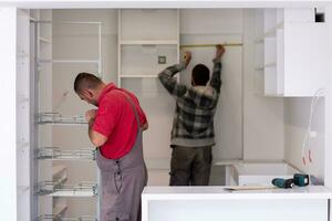 workers installing a new kitchen photo