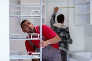 workers installing a new kitchen photo