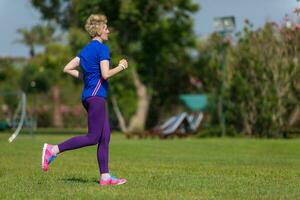 young female runner training for marathon photo