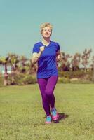 young female runner training for marathon photo