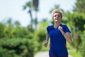 young female runner training for marathon photo