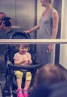 happy family in the elevator photo