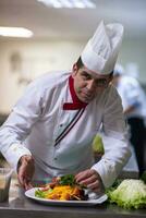 chef serving vegetable salad photo