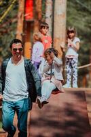 Family time in the park. Father have fun with his daughter in the park, playing fun games and spending time together photo