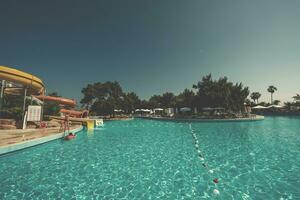 tropical swimming pool in hotel resort photo