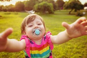 little girl spending time at backyard photo