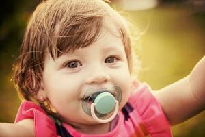 little girl spending time at backyard photo