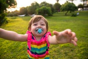 little girl spending time at backyard photo