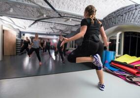 sporty women doing aerobics exercises photo