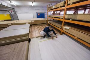 carpenter measuring wooden board photo