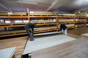 two young carpenters working in big modern carpentry photo