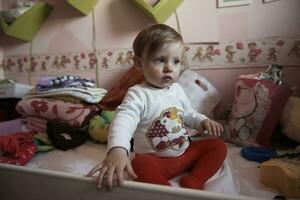 cute  little one year old baby and making first steps photo