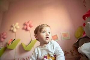 cute  little one year old baby and making first steps photo