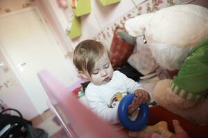 cute  little one year old baby and making first steps photo