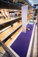 Interior of big modern shopping mall photo