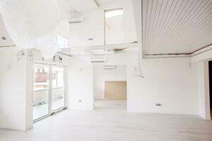 Interior of empty stylish modern open space two level apartment photo