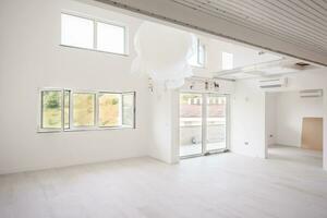 Interior of empty stylish modern open space two level apartment photo