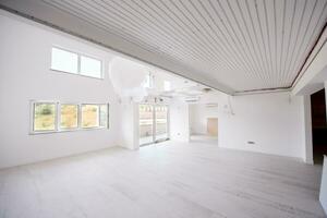 Interior of empty stylish modern open space two level apartment photo