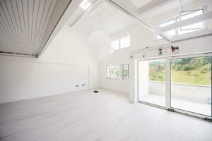 Interior of empty stylish modern open space two level apartment photo