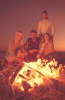 Friends having fun at beach on autumn day photo