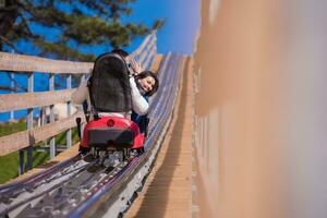 couple driving on alpine coaster photo