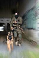 Modern Warfare Soldiers with military working dog in action on the battlefield. photo