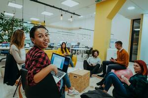 Multiethnic group of employees working in a marketing company. A group of colleagues is working on a project in modern offices photo