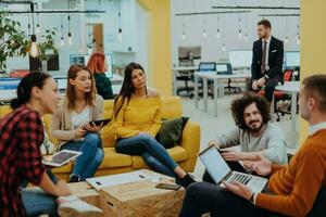 Multiethnic group of employees working in a marketing company. A group of colleagues is working on a project in modern offices photo