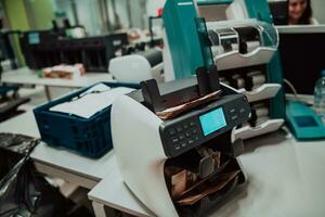 Sorted banknotes placed on the table after it is counted on the electronic money counting machine photo