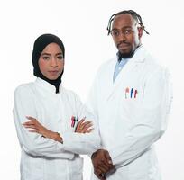 Closeup front view of group of mixed age doctors and nurses standing side by side and looking at the camera. Young Middle Eastern female in a team with African American male doctor. photo